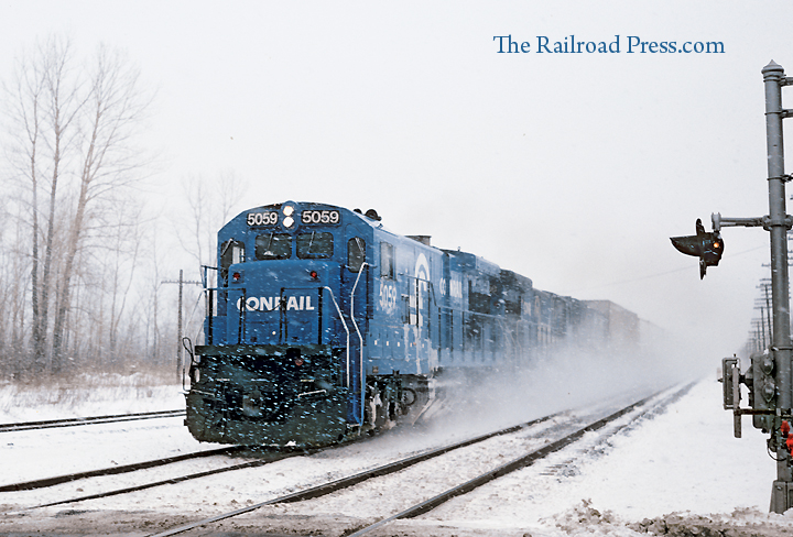 Conrail B36-7 leads a train through the snow on the former New York Central Water Level Route