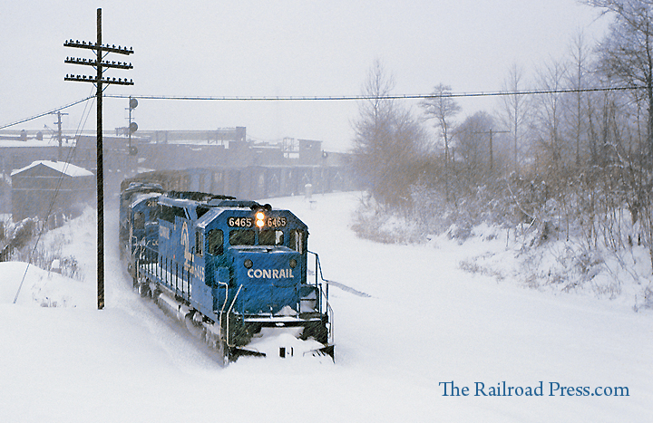 Conrail train entering Allentown yard at R Tower in a heavy snow during February 1979 behind SD40-2 #6465, a B23-7 and a GP8