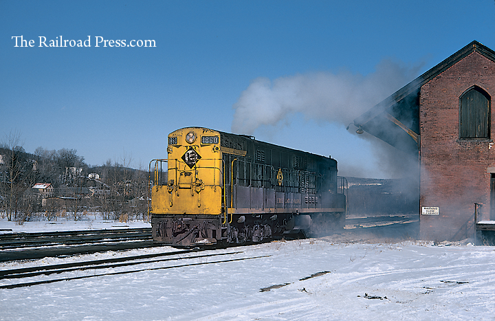 Erie Lackawanna Fairbanks-Morse H24-66 #1860 accelerates through Susquehanna, Pennsylvania, in February 1969