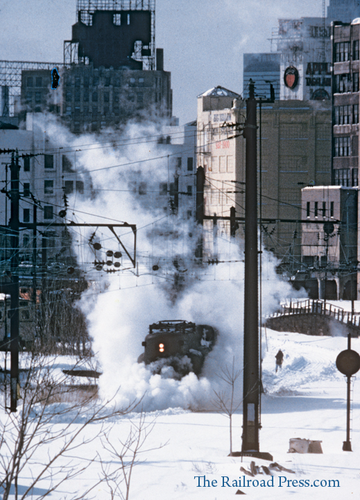 In early 1988, a New Jersey Transit GG1 is plowing snow at Long Island City, New York