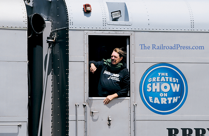 Ringling Brothers and Barnum & Bailey Circus employee Rhett Coates leans out of the Dutch door of the circus train on May 2, 2017
