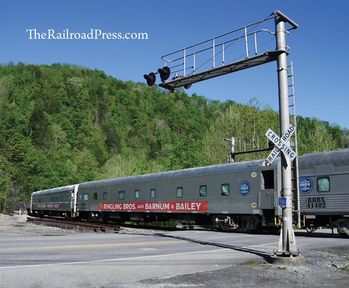 Ringling Brothers and Barnum & Bailey circus train passenger coaches crossing West Virginia State Highway 16 at (Pinnacle Junction) Pineville, West Virginia, on the morning of May 2, 2017